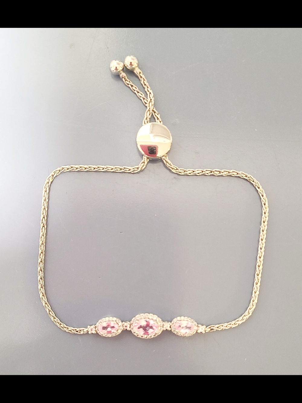 Adjustable Silver Bracelet with Pink Gem Accents